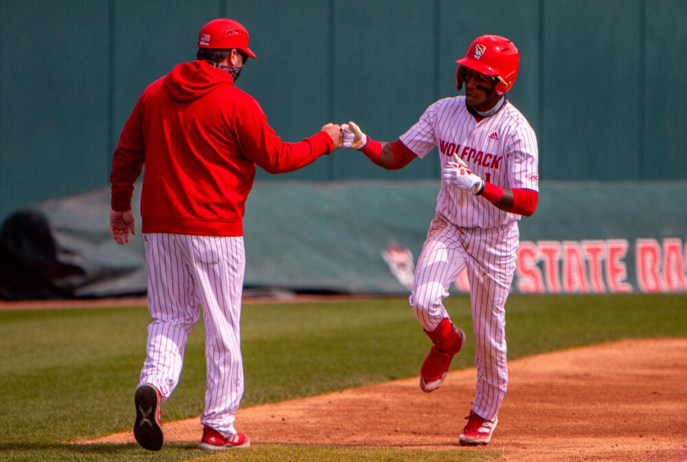 Junior outfielder Terrell Tatum rounds third base after hitting a home run against Louisville on Saturday, March 20, 2021 at Doak Field. Tatum went 2-4 as the Wolfpack lost 6-3.