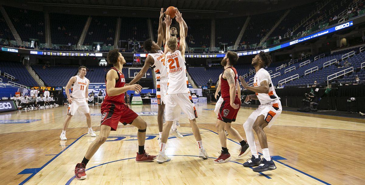 N.C. State&#8217;s Manny Bates (15) puts up a shot against the Syracuse zone defense during the second half on Wednesday, March 10, 2021 during the ACC Tournament at the Greensboro Coliseum in Greensboro, N.C.