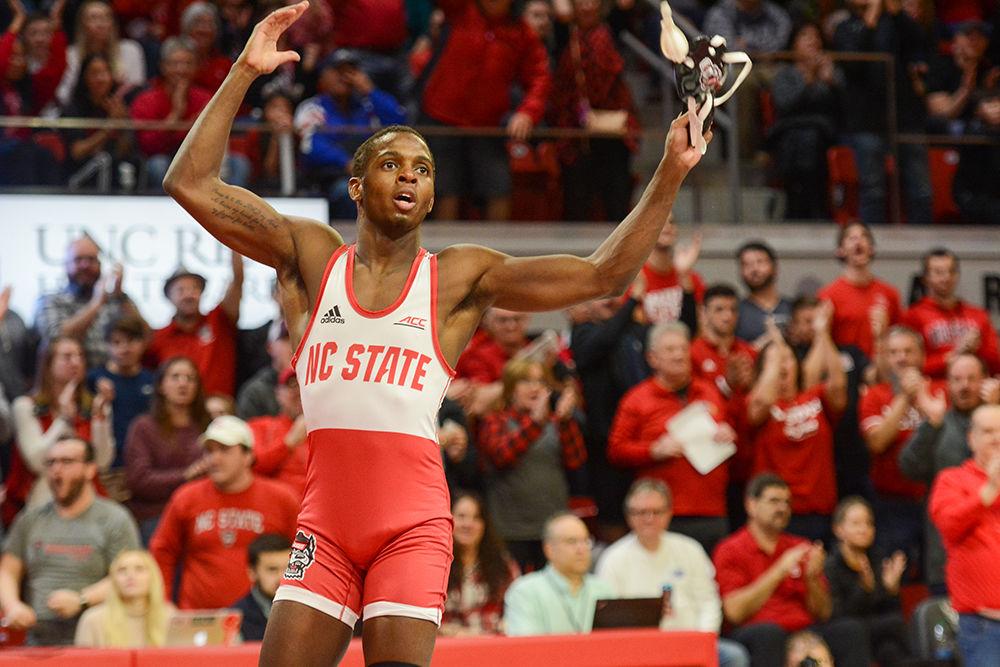 Tariq Wilson, a 141 pound redshirt junior, celebrates his victory against UNC-CH at the wrestling match on Friday, Feb. 7, 2020 at Reynolds Coliseum. The Wolfpack won against UNC-CH 19-14.