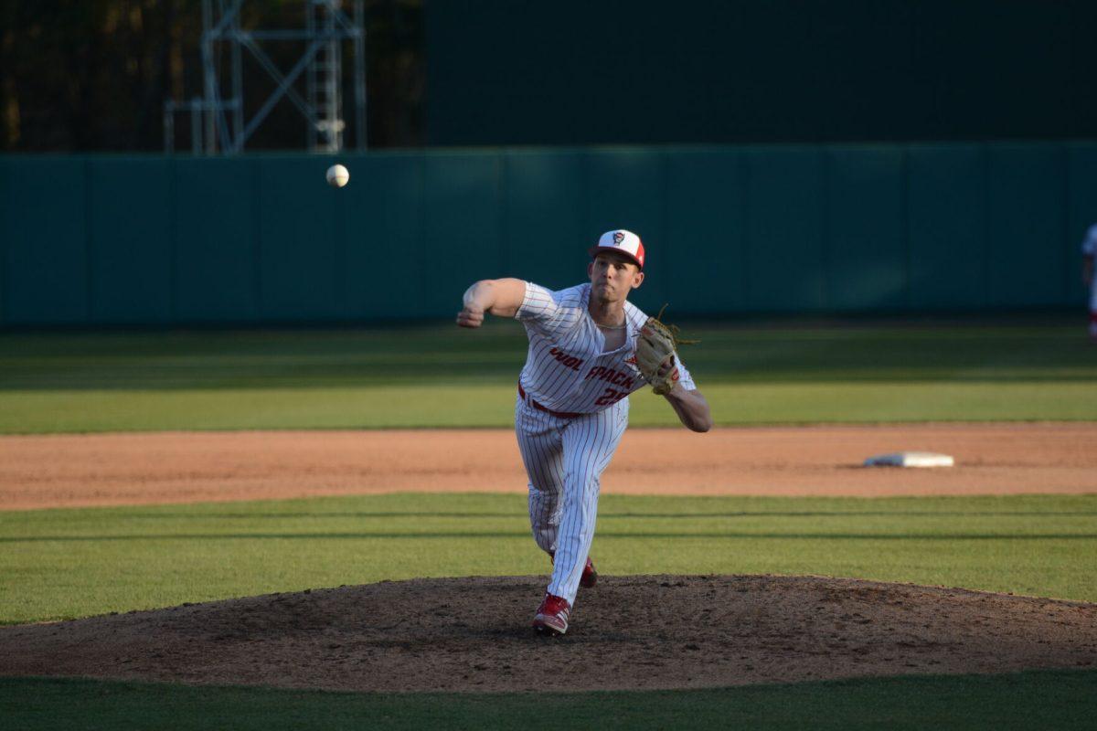 Junior Reid Johnston pitches on Friday, March 5, 2021 at Doak Field. Johnston allowed no runs scored after coming in as relief pitcher for the final 3 innings of the Wolfpack&#8217;s 11-5 win over Miami.