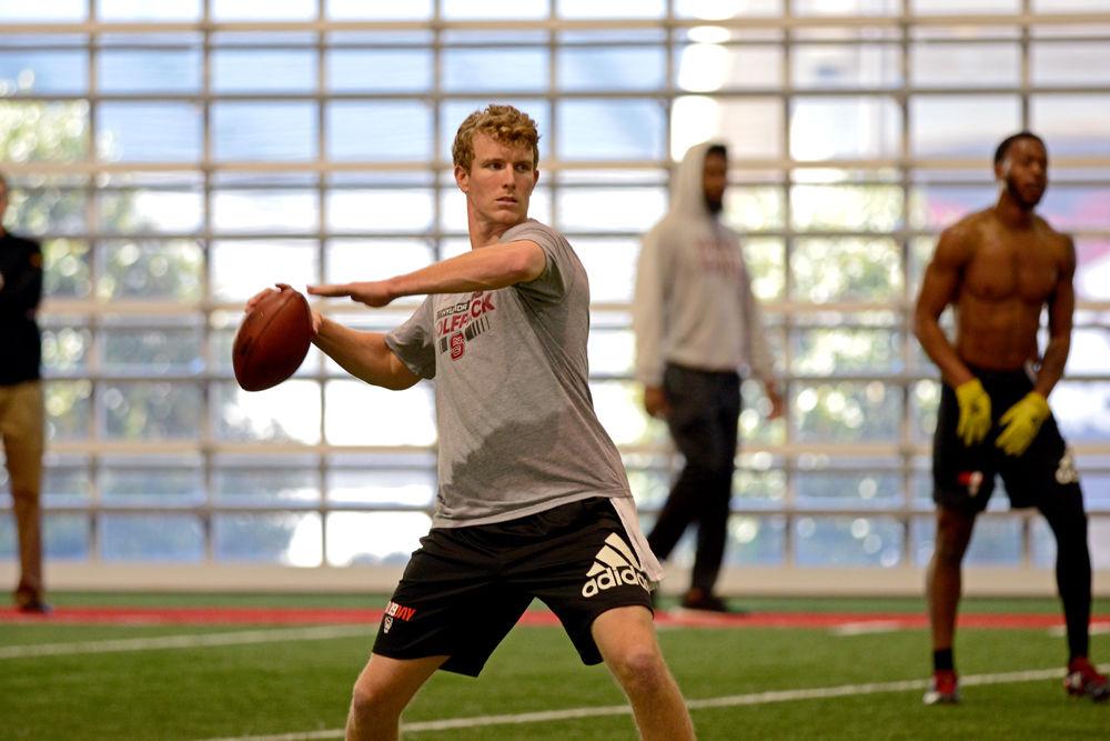 Graduate quarterback Ryan Finley throws a pass at NC State football&#8217;s pro day on Wednesday, March 27, 2019 in the Close-King Indoor Practice Facility.