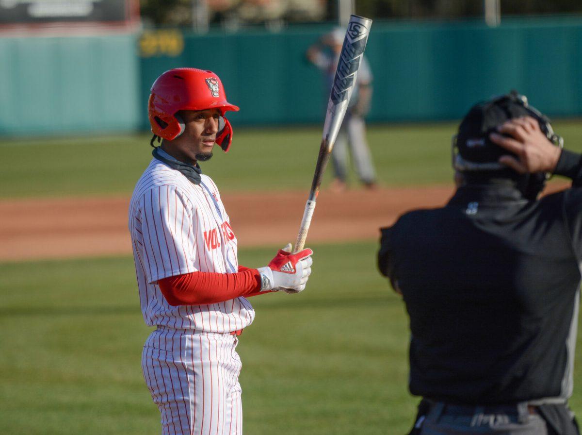 Freshman shortstop Jose Torres prepares himself before batting on Friday, March 5, 2021 at Doak Field. Torres finished with 2 hits and 2 RBIs in the Wolfpack&#8217;s 11-5 win over the Miami Hurricanes.
