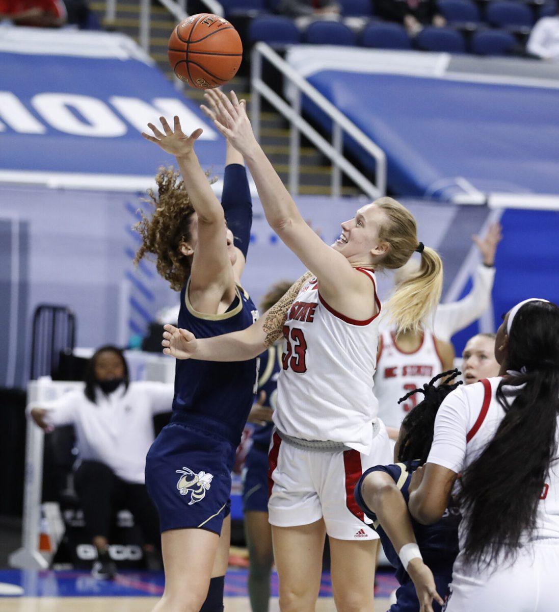 N.C. State's Elissa Cunane (33) shoots as Georgia Tech's Lorela Cubaj (13) defends during the first half of N.C. State&#8217;s game against Georgia Tech in the semifinals of the ACC Women&#8217;s Basketball Tournament in Greensboro, N.C., Saturday, March 6, 2021.