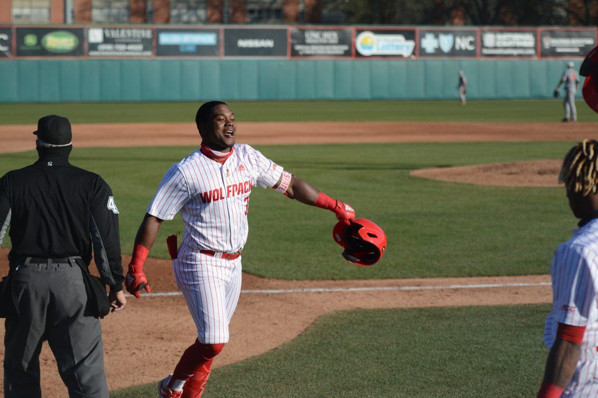 Junior Devonte Brown celebrates after hitting a home run on Friday, March 5, 2021 at Doak Field. Brown added 2 RBIs from his home run which propelled NC State to a 11-5 win over Miami.