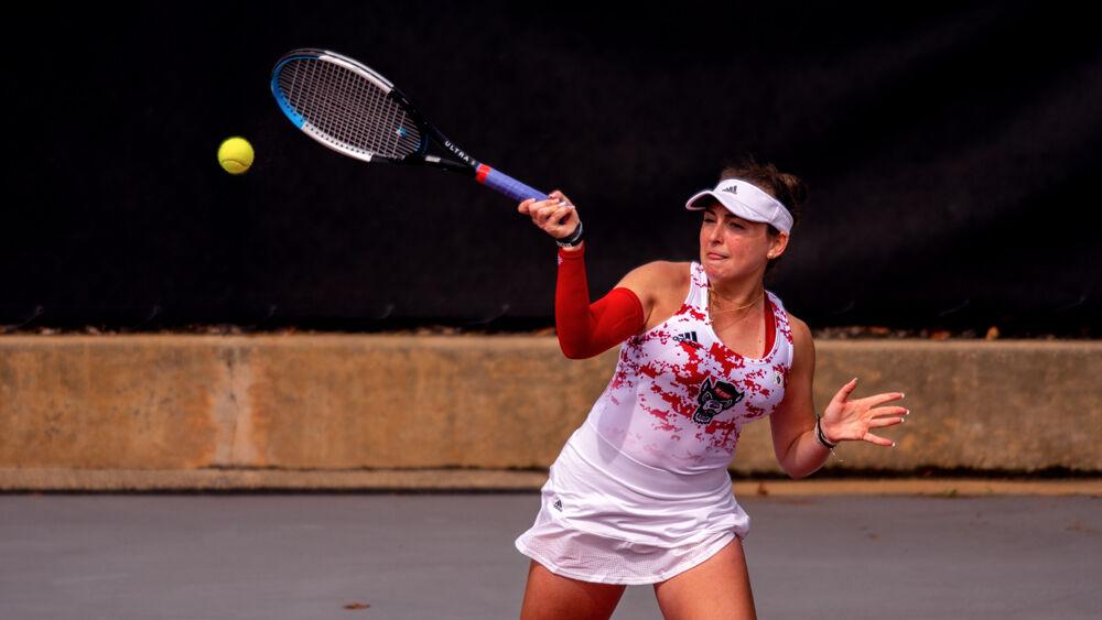 Freshman Abigail Rencheli returns the ball against UNC-Charlotte on Wednesday, March 24, 2021 at J.W. Isenhour Tennis Center. Rencheli won her doubles match with freshman Amelia Rajecki 6-2 as well as her singles match 6-2, 6-3 to help the Wolfpack to a 5-0 victory.