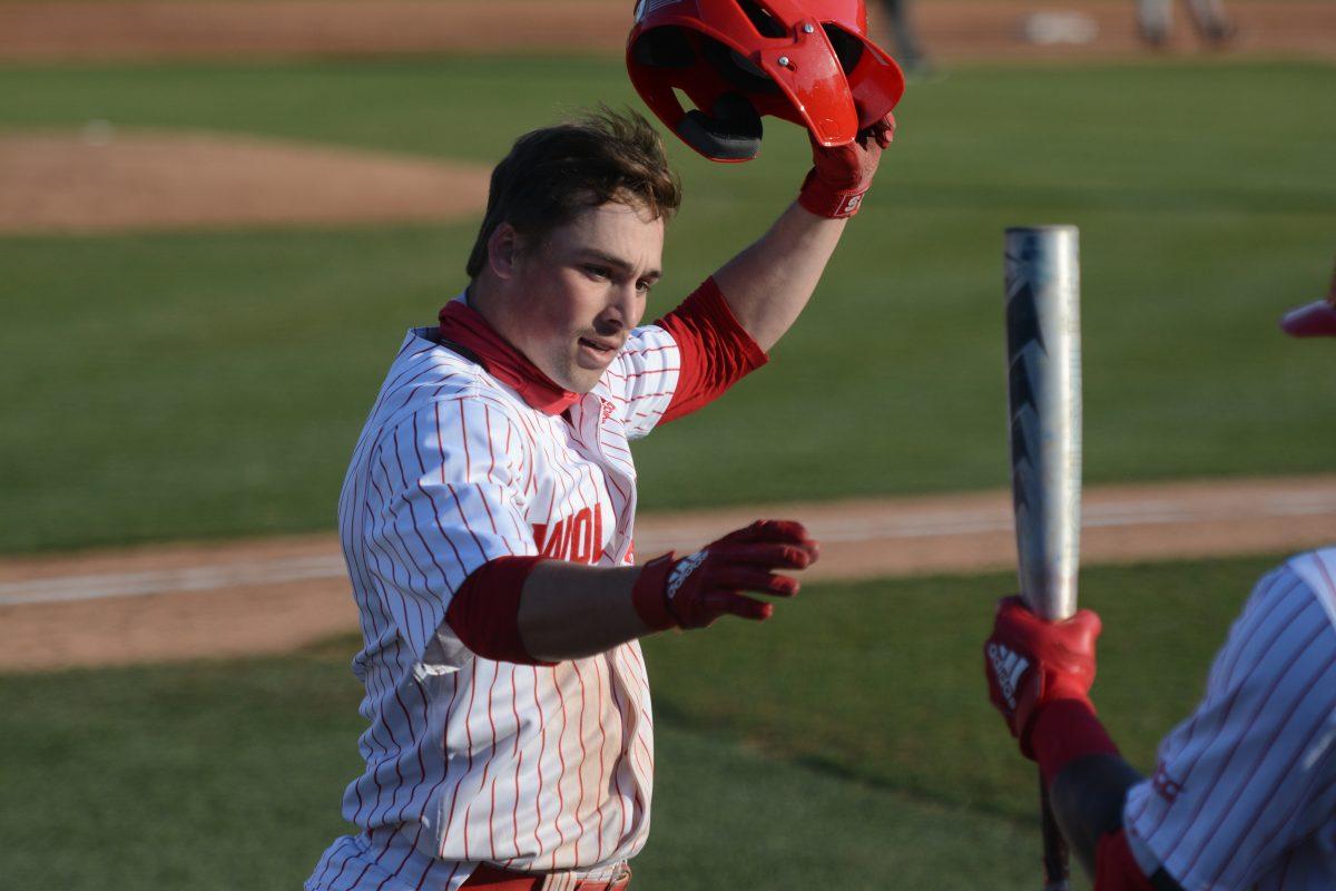 Sophomore Tyler McDonough celebrates with his teammates after hitting a solo home run on Friday, March 5, 2021 at Doak Field. On 2 hits, McDonough scored 3 runs in NC State&#8217;s 11-5 win over Miami.