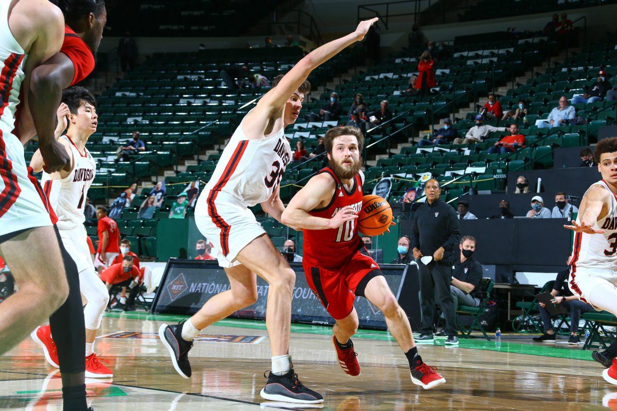 Braxton Beverly drives towards the basket during NC State's opening NIT game against Davidson on March 18, 2021 in UNT Coliseum in Denton, Texas. NC State won 75-61.
