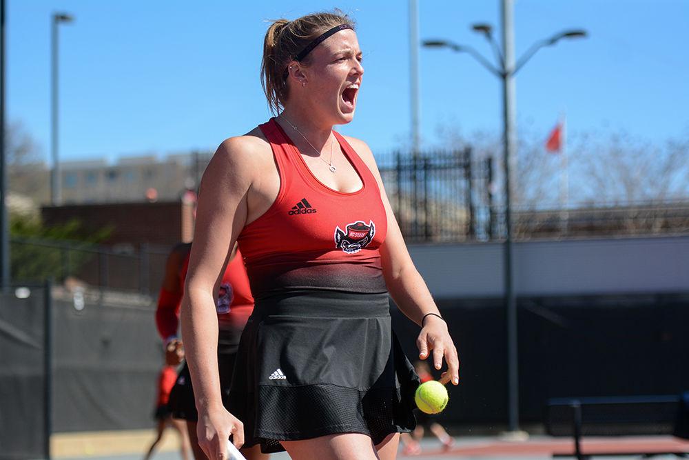 Anna Rodgers, a fourth year in business administration, celebrates the victory against Virginia at the women's tennis match on Sunday, March 1, 2020 at J.W. Isenhour Tennis Center. Rodgers and Smith won their doubles match 6-2.