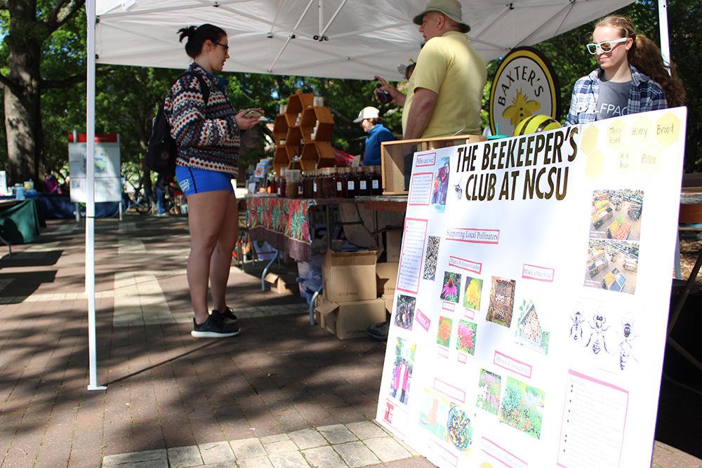 The Beekeepers Club sells honey and other products at the Earth Fair in the Brickyard on April 22, 2019.&#160;