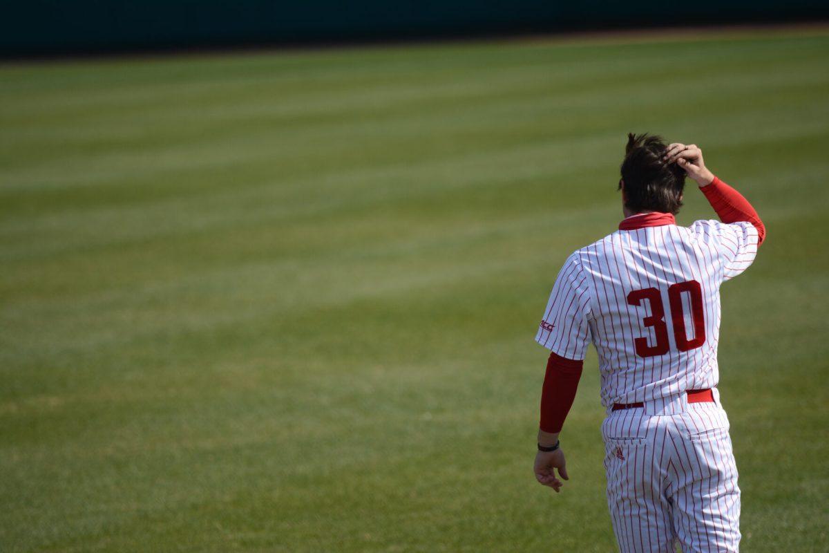 Freshman infielder Carson Falksen walks onto Doak Field on Friday, March 5, 2021. NC State won the opening game of a 3 game series against the sixth ranked Miami Hurricanes with a score of 11-5.