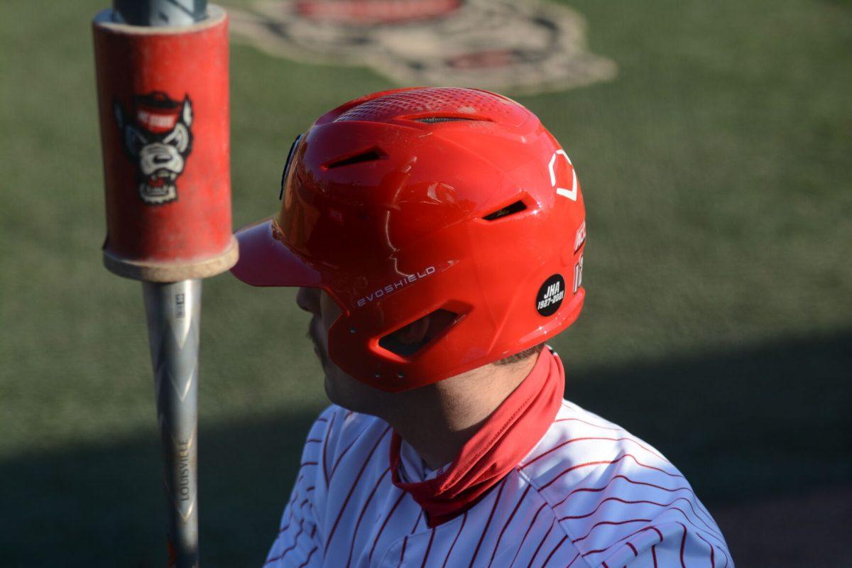 Junior first baseman Austin Murr warmsup before batting on Friday, March 5, 2021 at Doak Field. The Wolfpack beat the Miami Hurricanes by a score of 11-5.
