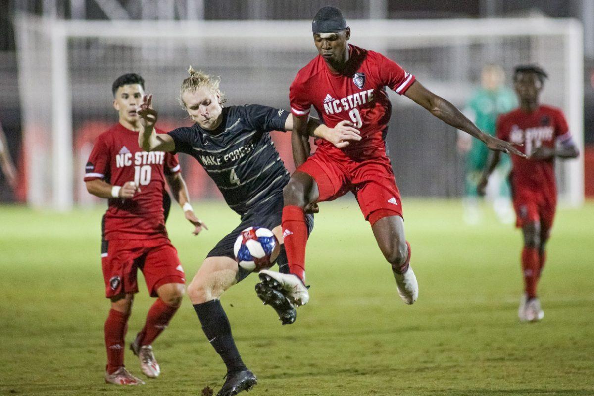 Sophomore forward Kuda Muskwe jumps through to control a loose ball. Muskwe had one shot on target during the 3-1 loss to No. 6 Wake Forest on Friday, Oct. 11, 2019 in Dail Soccer Stadium.