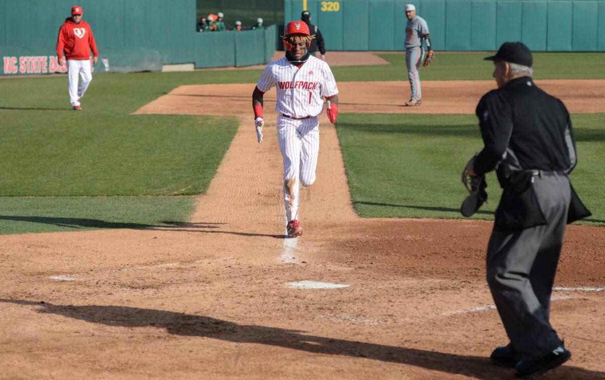 Junior outfielder Tarrell Tatum runs home after a passed ball on Friday, March 5, 2021 at Doak Field. Tatum acted as designated hitter during the Wolfpack&#8217;s 11-5 win over the sixth ranked Miami Hurricanes.