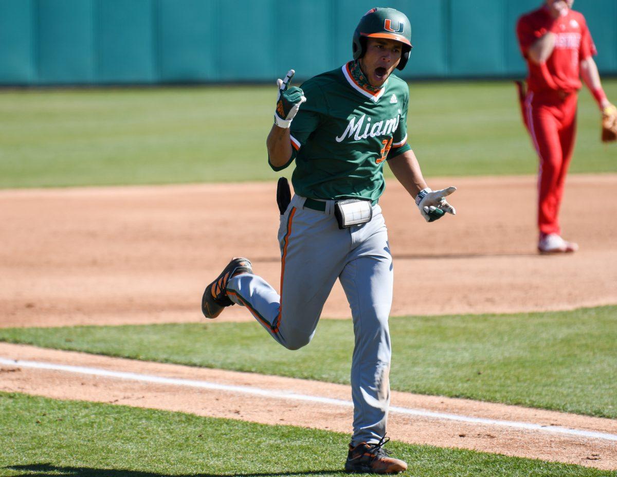 Miami Hurricanes infielder Yohandy Morales celebrates his first home run of the day against the NC State Wolfpack on Sunday, March 7, 2021 in Doak Field at Dail Park. The Hurricanes beat the Wolfpack 6-4.
