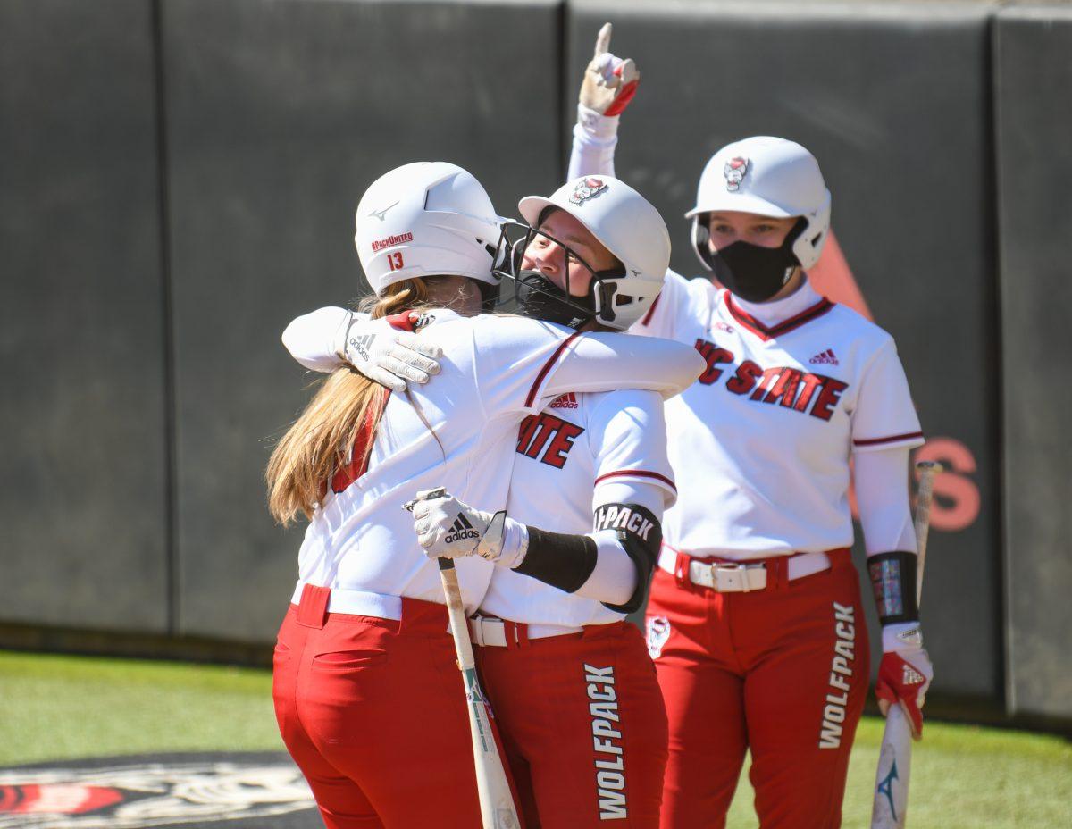 Redshirt junior infielder Randi Farricker celebrates with her teammates after hitting a home run during the game versus the Georgia Tech Yellow Jackets on Sunday, March 7, 2021 in Dail Stadium. The Wolfpack beat the Yellow Jackets 5-2.