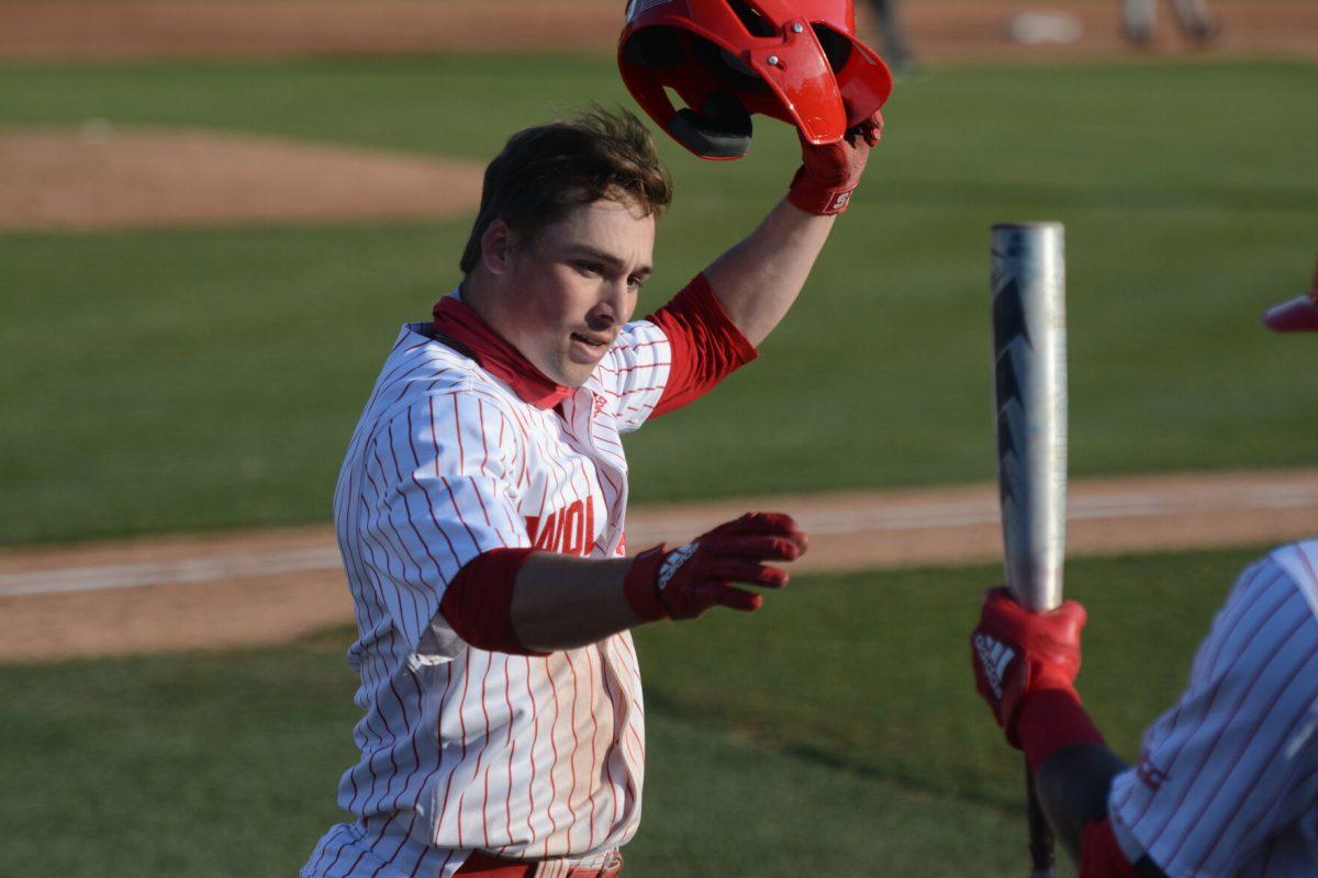 Sophomore Tyler McDonough celebrates with his teammates after hitting a solo home run on Friday, March 5, 2021 at Doak Field. On 2 hits, McDonough scored 3 runs in NC State&#8217;s 11-5 win over Miami.