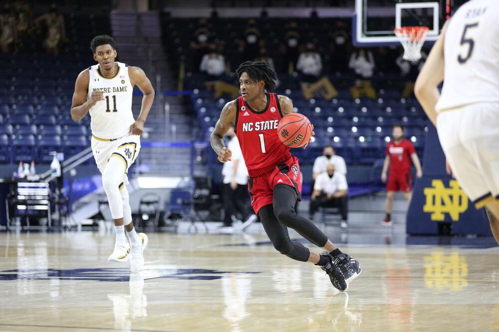 NC State freshman guard Dereon Seabron dribbles down the court during the Wolfpack's 80-69 win over Notre Dame on March 3, 2021. Seabron scored 17 points with 13 rebounds in the game.