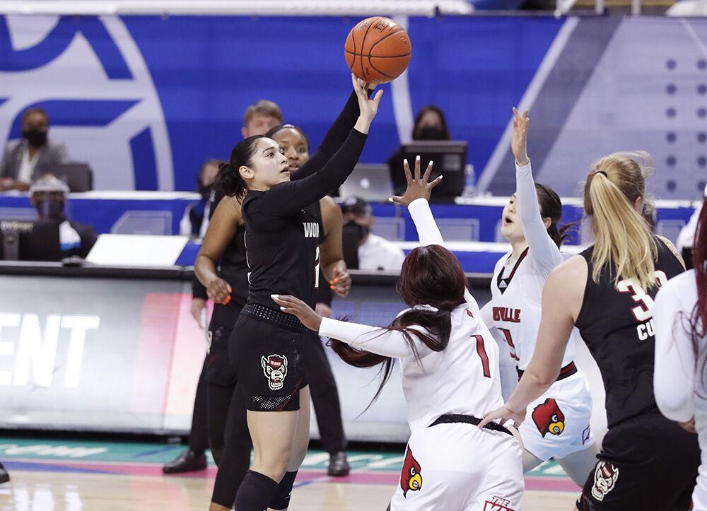 N.C. State's Raina Perez (2) makes what would be the game winning basket with two seconds left in the game during N.C. State&#8217;s 56-54 victory over Louisville in the finals of the ACC Women&#8217;s Basketball Tournament in Greensboro, N.C., Sunday, March 7, 2021.