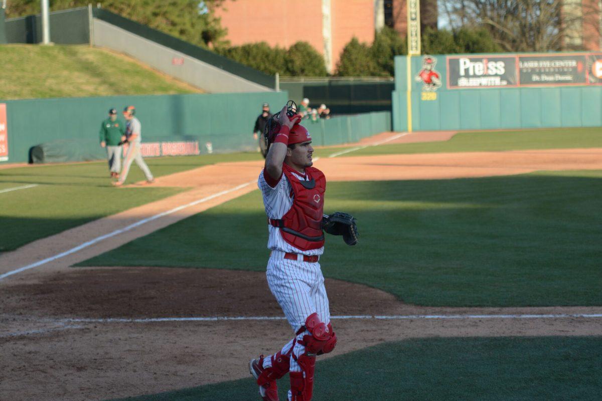 Sophomore catcher Luca Tresh runs off field after a successful inning on Friday, March 5, 2021 at Doak Field. Tresh had 2 hits including a solo home run during the Wolfpack&#8217;s 11-5 win over the Miami Hurricanes.