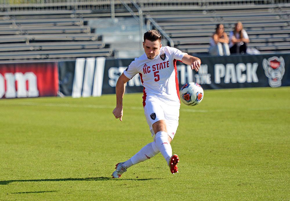 Junior defender Jamie Smith kicks the ball up the field in Dail Soccer Field on November 6, 2019. The Wolfpack won 2-1 over the Duke Blue Devils and advanced to the second round of the ACC tournament.