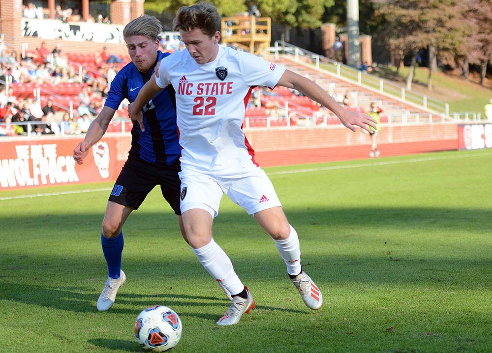 Sophomore middle fielder, Aidan Foster protects the ball from a Duke defender at Dail Soccer Field on November 6, 2019. The Wolfpack won 2-1 over the Blue Devils and will advance to the second round of the ACC tournament.