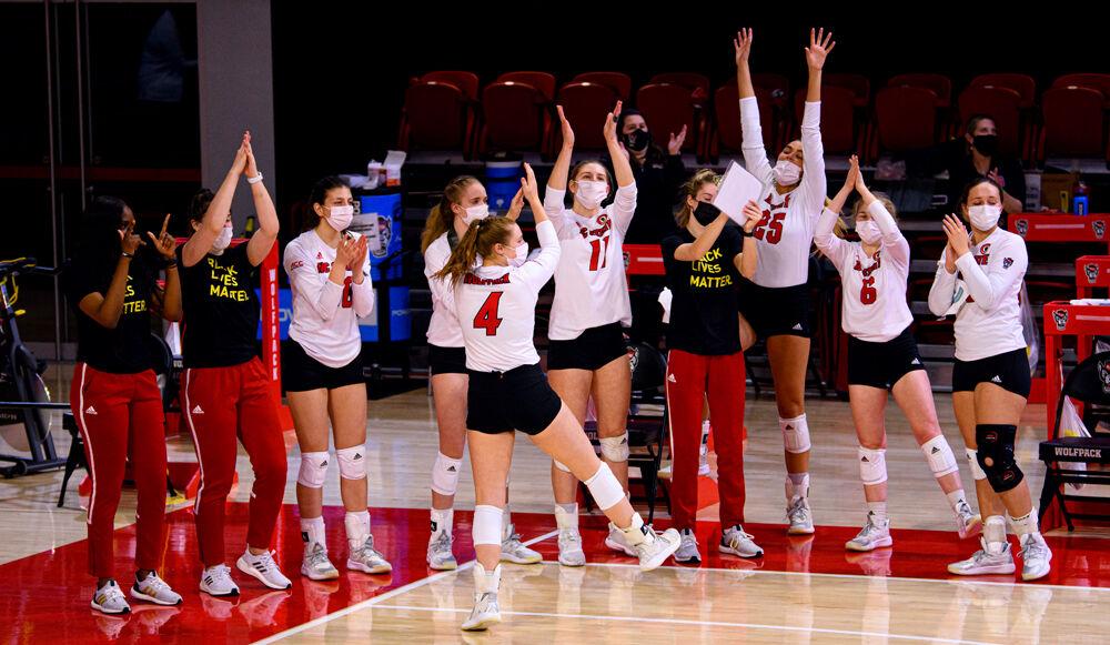 The bench celebrates a Wolfpack point against Duke on Friday, Feb. 26, 2021 at Reynolds Coliseum. The Pack won in five sets.