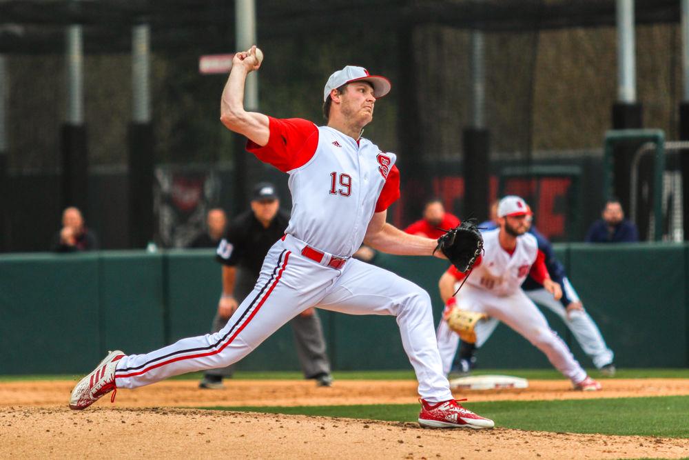 Redshirt sophomore pitcher Dalton Feeney pitches the ball on Sunday, March 31, 2019 at Doak Field at Dail Park. Feeney pitched three innings and had three strikeouts in the Wolfpack's 8-7 win against the Virginia Cavaliers.