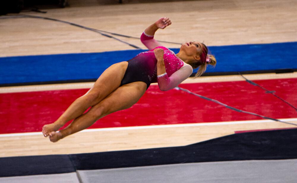 Senior Nicole Webb performs on the floor on Saturday, Feb. 6, 2021 at Reynolds Coliseum. The Wolfpack took first place over North Carolina, Pitt and Towson with a team score of 196.025.