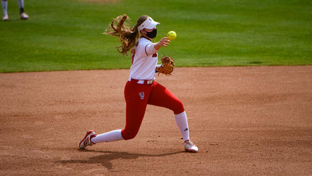 Redshirt junior infielder Randi Farricker throws to first base against Virginia Tech on Sunday, March 14, 2021 at Dail Softball Stadium. The Wolfpack lost 17-4 after five innings.