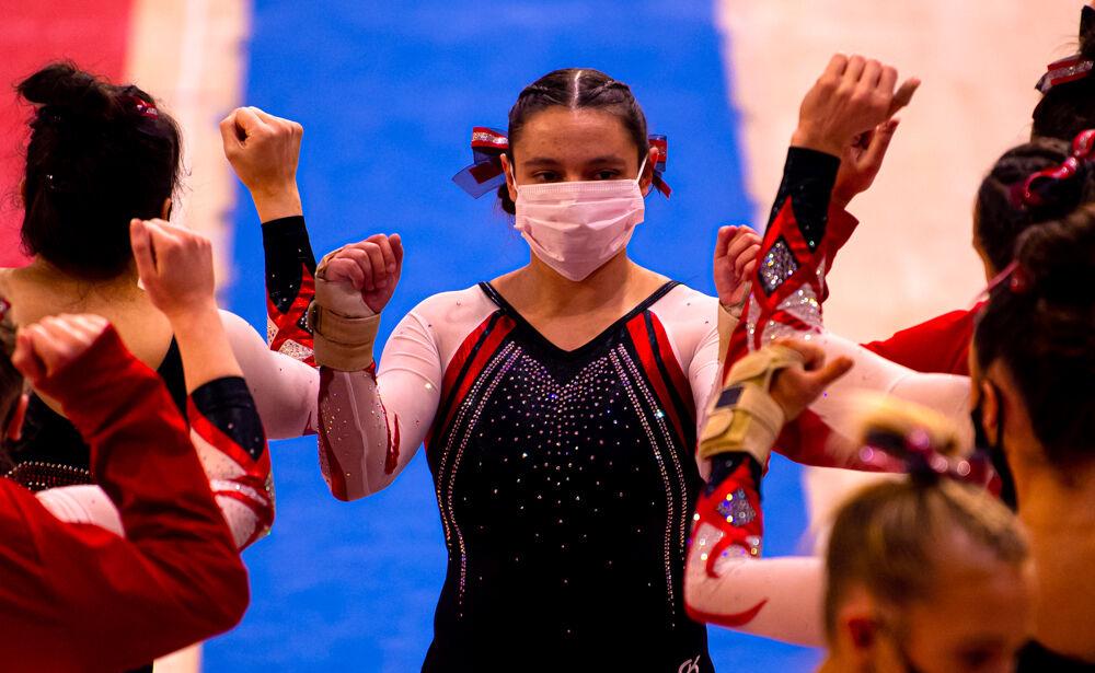 Sophomore Chloe Negrete greets her teammates after performing on the vault on Saturday Feb. 27, 2021 at Reynolds Coliseum. Negrete scored highest on the vault with a 9.850. The Wolfpack took first place in the tri-meet over North Carolina and Temple with a score of 196.200.