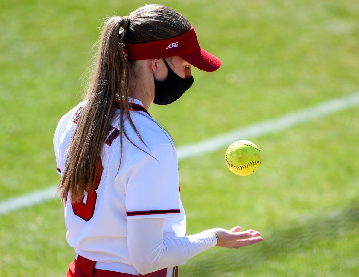 Redshirt junior infielder Randi Farricker tosses a softball before the final game of the Georgia Tech series on Sunday, March 7, 2021 in Dail Stadium. Farricker had one home run for NC State. The Wolfpack beat the Yellow Jackets 5-2.