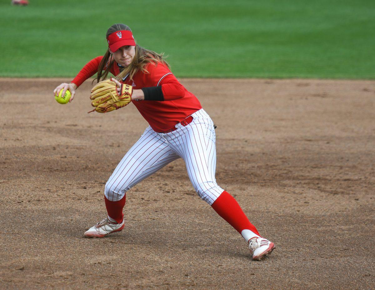 Redshirt junior infielder Randi Farricker throws the ball to first base during the game versus Louisiana State University on Saturday, April 18, 2021 in Dail Softball Stadium. The Wolfpack lost to the Tigers 2-1.