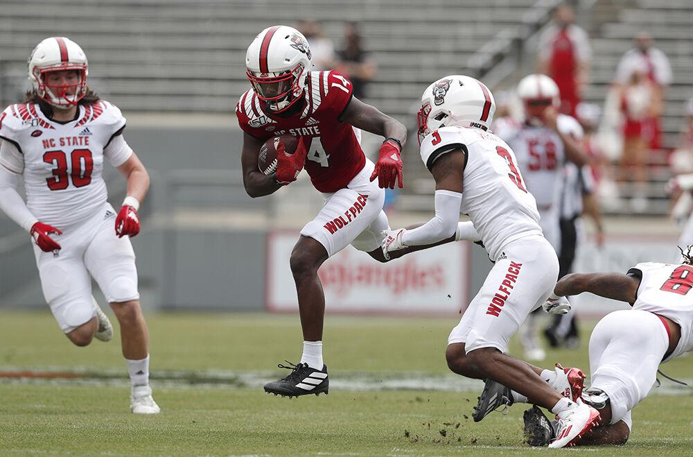 N.C. State wide receiver Porter Rooks (14) beats the defense on his way to a touchdown during the first half of N.C. State football&#8217;s spring game at Carter-Finley Stadium in Raleigh, N.C., Saturday, April 10, 2021.