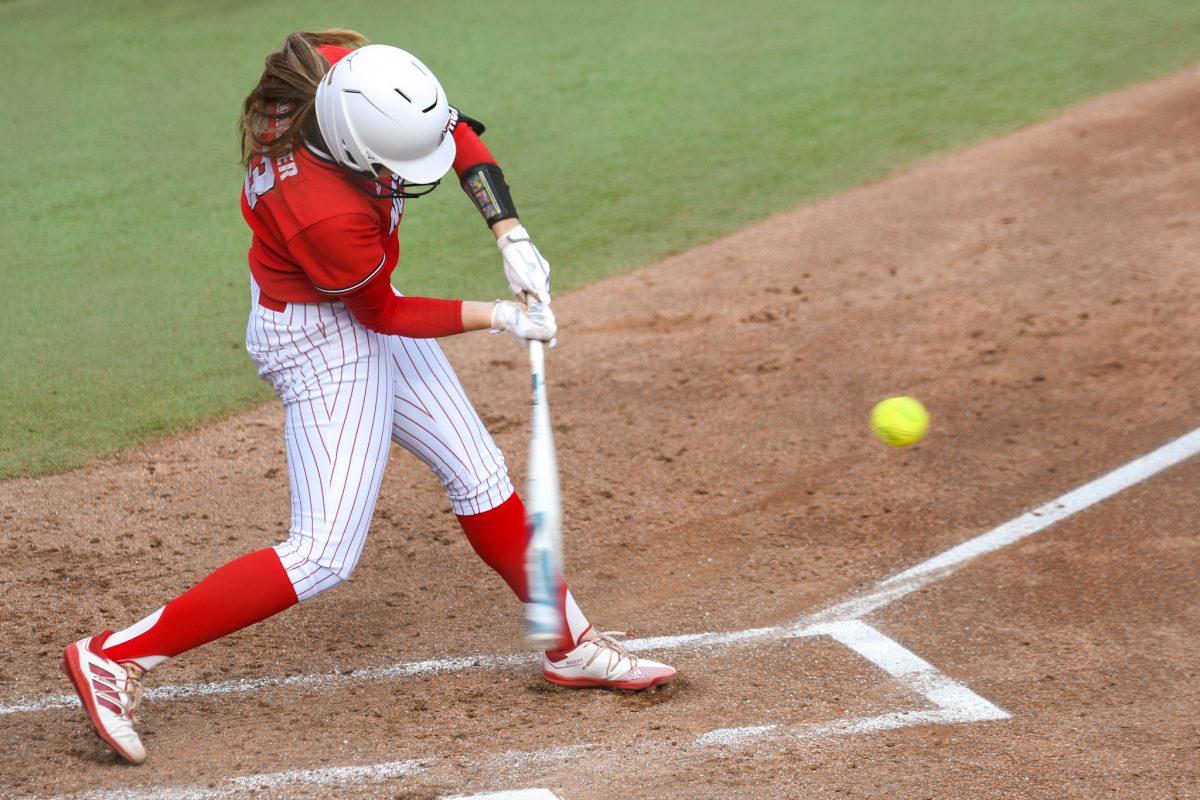 Redshirt junior infielder Randi Farricker hits a pitch during the game versus Louisiana State University on Saturday, April 17, 2021 in Dail Softball Stadium. The Wolfpack lost to the Tigers 2-1.