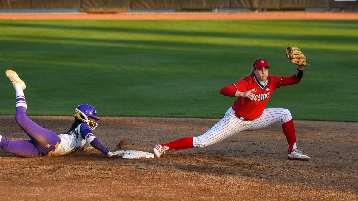 Redshirt junior infielder Randi Farricker tags out a second base runner during the game versus Louisiana State Universtiy on Saturday, April 18, 2021 in Dail Softball Stadium. The Wolfpack lost to the Tigers 2-1.