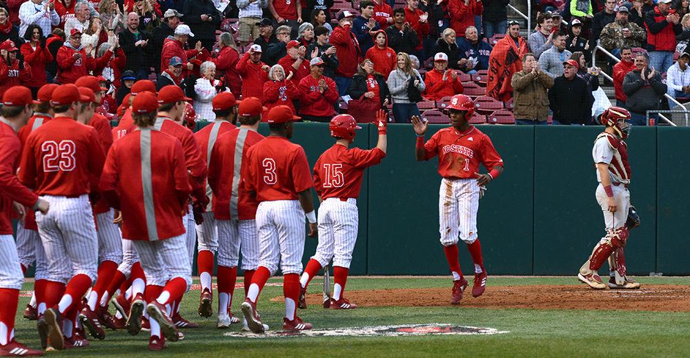 Sophomore outfielder Terrell Tatum and sophomore infielder J.T Jarrett high five during the game against Florida State, on Saturday, March 16 at Doak Field. The Wolfpack won 9-8.