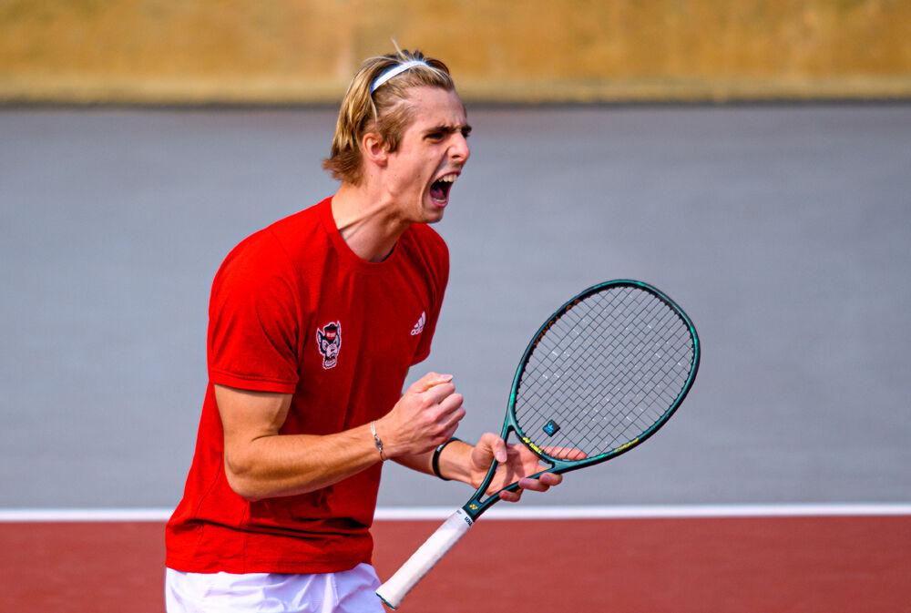 Sophomore Robin Catry celebrates winning a point against Florida State on Friday, March 12, 2021 at J.W. Isenhour Tennis Center. The Wolfpack won 4-0.
