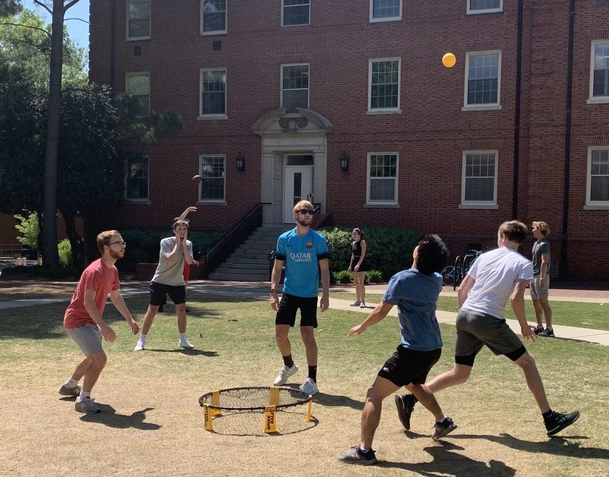 Students play spikeball on the field between Alexander and Turlington halls on April 30, 2021.&#160;