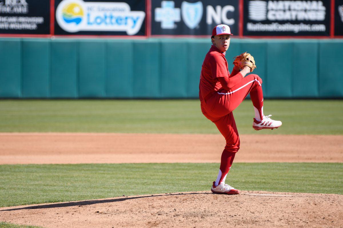 Freshman pitcher Chris Villaman winds up for a pitch during the game versus the Miami Hurricanes on Sunday, March 7, 2021 in Doak Field at Dail Park. The Hurricanes beat the Wolfpack 6-4.