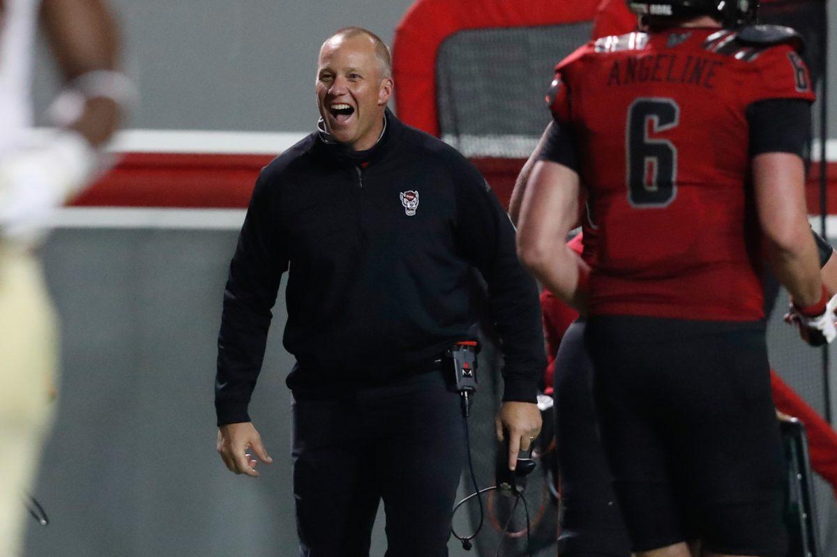 N.C. State head coach Dave Doeren celebrates after a Wolfpack touchdown during the second half of N.C. State&#8217;s 38-22 victory over Florida State at Carter-Finley Stadium in Raleigh, N.C., Saturday, Nov. 14, 2020.