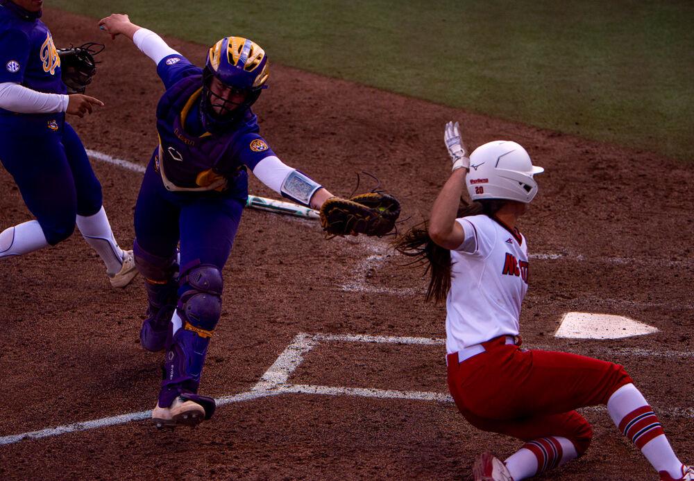 Redshirt sophomore infielder April Visser reaches toward home plate against No. 15 LSU on Friday, April 16, 2021 at Dail Softball Stadium. Visser was initially ruled safe, but then called out of the basepath. The Wolfpack won 3-1.