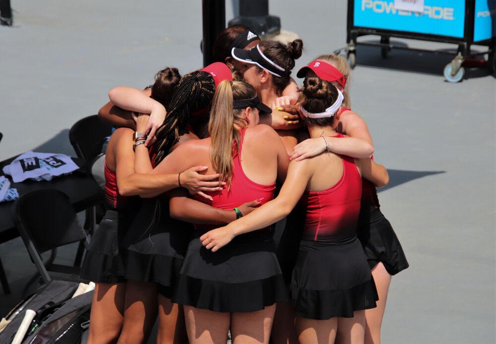 NCSU Women's Tennis teammates hug the seniors before their game against the Hokies at J.W. Isenhour Tennis Center on Friday, April 9th, 2021. NCSU won 7-0.