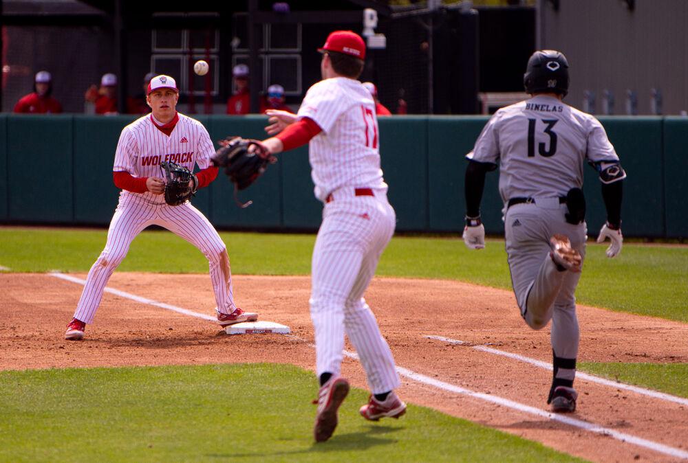 Freshman pitcher Sam Highfill throws to sophomore infielder Vojtech Mensik on Saturday, March 20, 2021 at Doak Field. The Wolfpack lost 6-3.