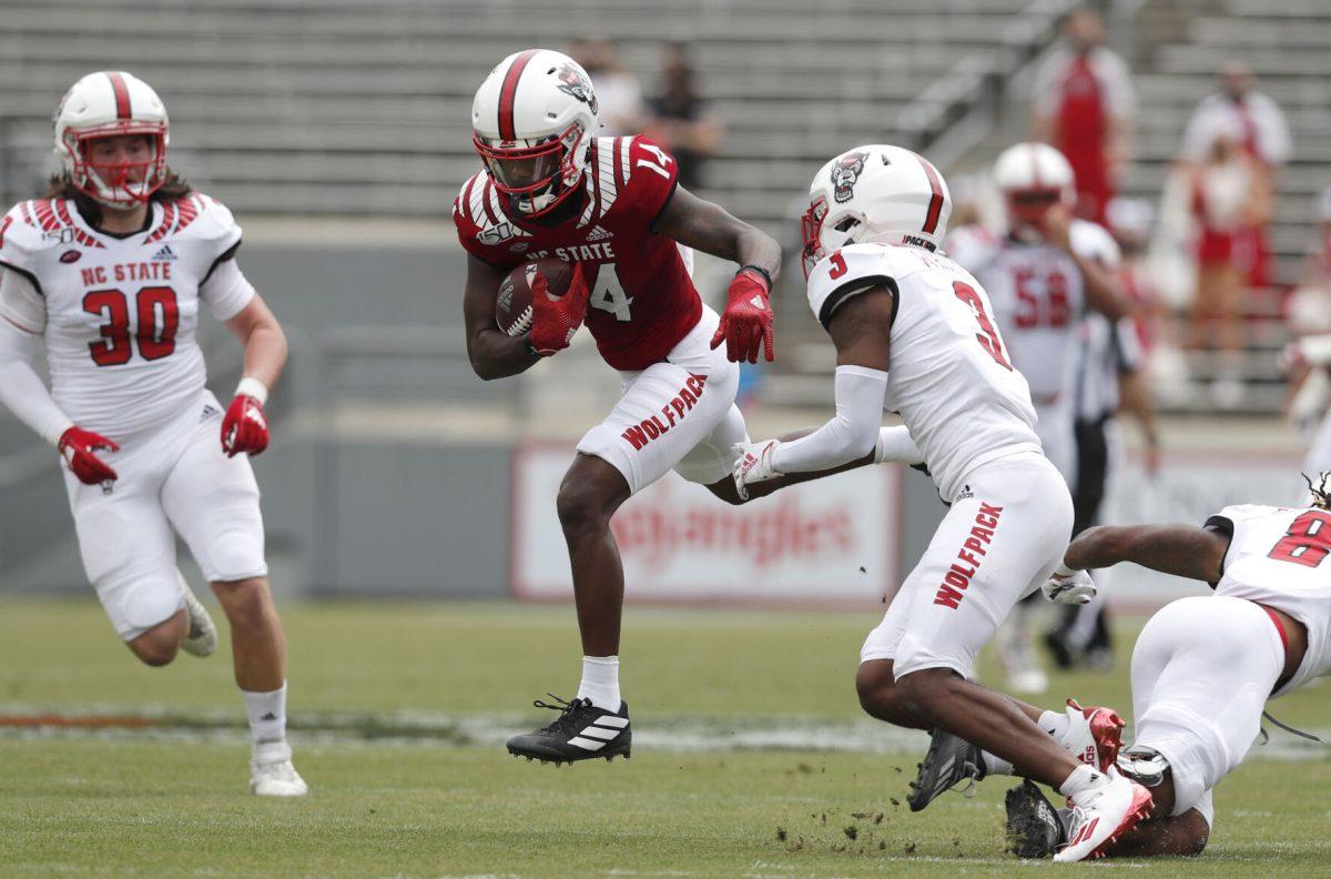 N.C. State wide receiver Porter Rooks (14) beats the defense on his way to a touchdown during the first half of N.C. State football&#8217;s spring game at Carter-Finley Stadium in Raleigh, N.C., Saturday, April 10, 2021.