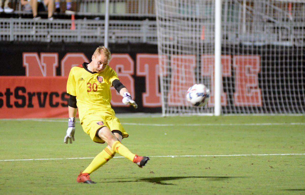 Freshman goalkeeper Leon Krapf kicks the ball upfield during the game against the Virginia Cavaliers. The Wolfpack tied the Cavaliers 0-0 in Dail Soccer Stadium on Oct. 13, 2017.&#160;