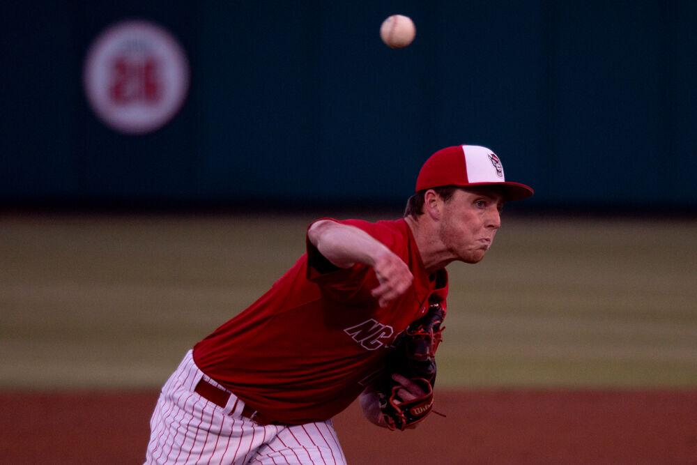Freshman pitcher Sam Highfill delivers the ball against Virginia Tech on Friday, April 23, 2021 at Doak Field. Highfill struck out six and gave up no earned runs in 6.2 innings as the Wolfpack won 3-1.