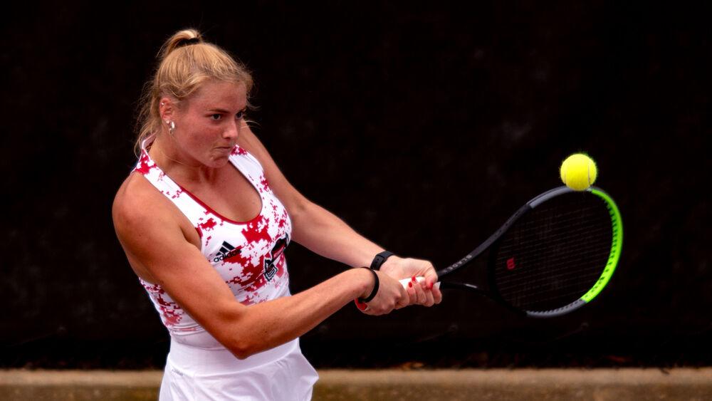 Fifth-year Anna Rogers returns the ball against UNC-Charlotte on Wednesday, March 24, 2021 at J.W. Isenhour Tennis Center. Rogers won her doubles match with junior Alana Smith 6-2, as well as her singles match 6-3, 6-1 to help the Wolfpack to a 5-0 victory.