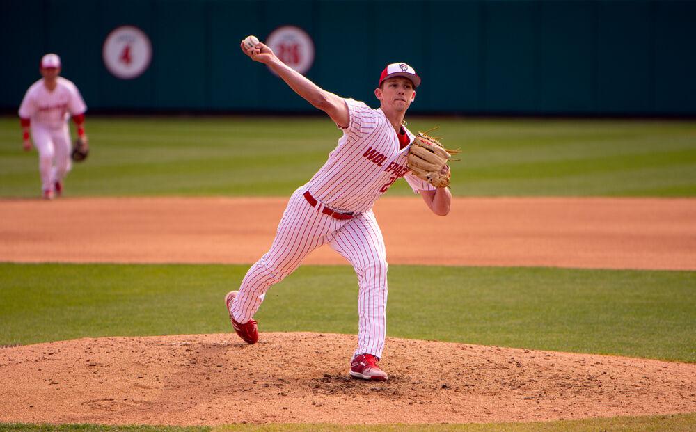 Junior pitcher Reid Johnston pitches against Louisville on Saturday, March 20, 2021 at Doak Field. Johnston pitched four and one-third innings, giving up one earned run on six hits while striking out two. The Wolfpack lost 6-3.