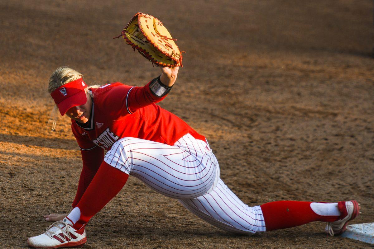 Redshirt freshman infielder Libby Whittaker tags out a runner at first base during the game against Louisiana State Universtiy on Saturday, April 18, 2021 in Dail Softball Stadium. The Wolfpack lost to the Tigers 2-1.