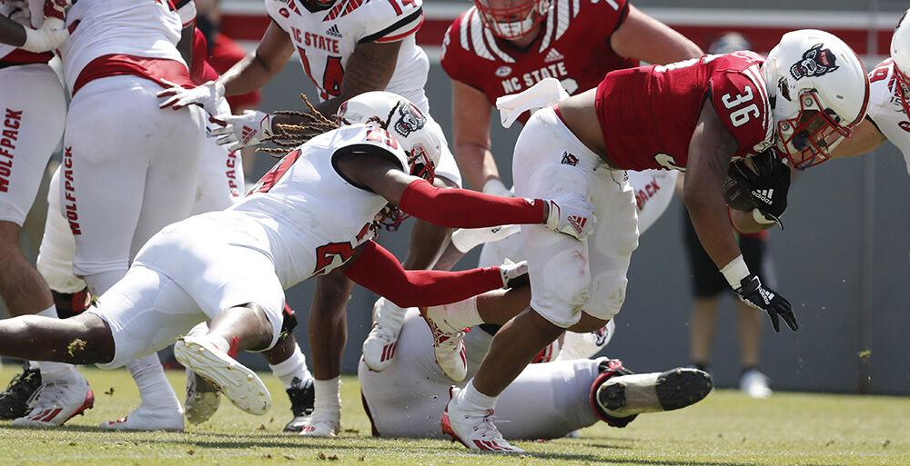 N.C. State running back Demarcus Jones II (36) beats Sean Brown (29) to score during the second half of N.C. State football&#8217;s spring game at Carter-Finley Stadium in Raleigh, N.C., Saturday, April 10, 2021.